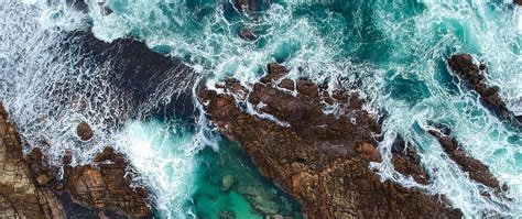 Download Wallpaper 2560x1080 Rocks Ocean Aerial View Coast Waves