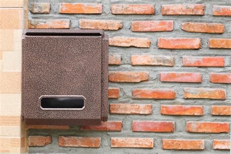 Premium Photo Brown Mailbox On Brick Wall