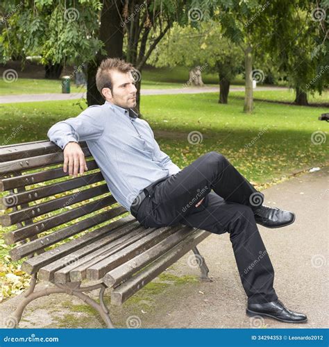 Man Sitting On A Bench In The Park Stock Image Image 34294353
