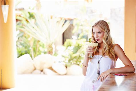 Beautiful Woman Drinking A Margarita In Mexico By Stocksy Contributor