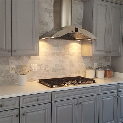 This stainless steel design from brother vs. Kitchen- gray cabinets, subway tile backsplash, modern rangehood | Grey kitchens, Grey cabinets ...