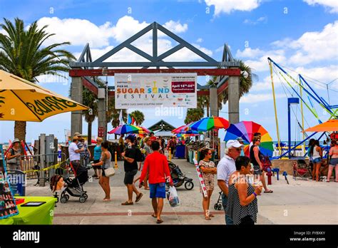People On The Boardwalk At The Entrance To The Clearwater Beach Pier In