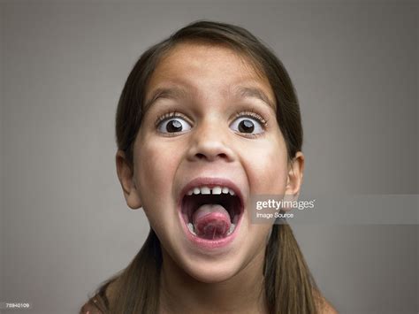 Girl Sticking Out Tongue Stock Photo Getty Images