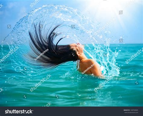 Beauty Model Girl Splashing Water With Her Hair In The Ocean Beautiful Woman In Water Stock