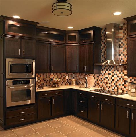 Our client had 1990's pickled maple, standard cabinets and desired an upgrade to complement u0003their existing granite. Perimeter Cabinets: Espresso Cherry, Homestead door style. Special Features: Stacked Cabinets ...