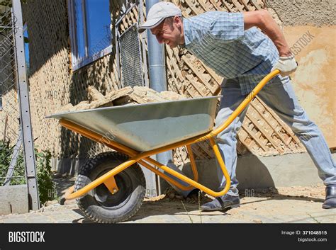 Man Wheelbarrow Image And Photo Free Trial Bigstock