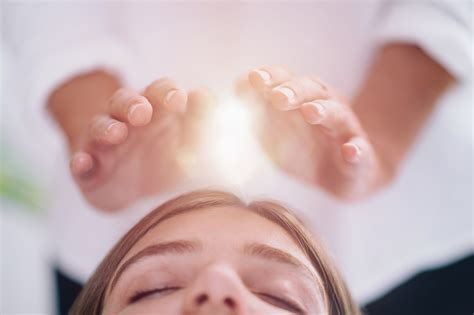 Close Up Of A Relaxed Young Woman Having Reiki Healing Treatment Susan Tara Meyer