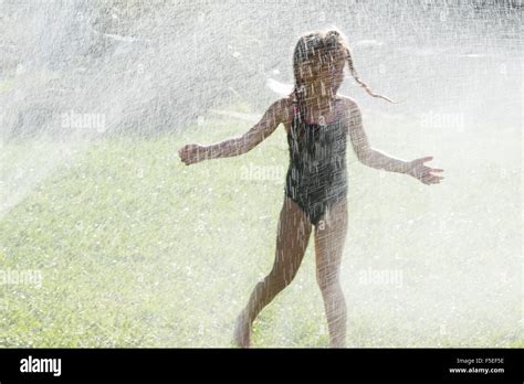 Girls Playing In The Water Hi Res Stock Photography And Images Alamy