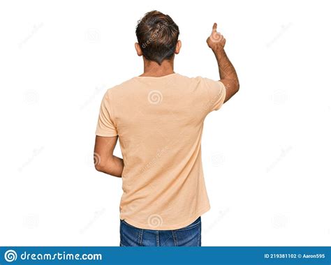 Handsome Young Man With Beard Wearing Casual Tshirt Posing Backwards