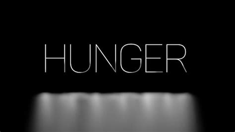 Premium Photo Hunger White Neon Light Text On A Black Background With