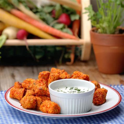 Crunchy, sweet carrot sticks are topped with creamy peanut butter in this healthy snack that will keep you going all afternoon. Cheesy Carrot Tots | Vegetarian snacks recipes, Carrot ...