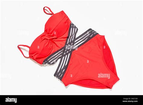 Two Red Bikinis One With Black Stripes And The Other With Grey Stripeing On The Top Half