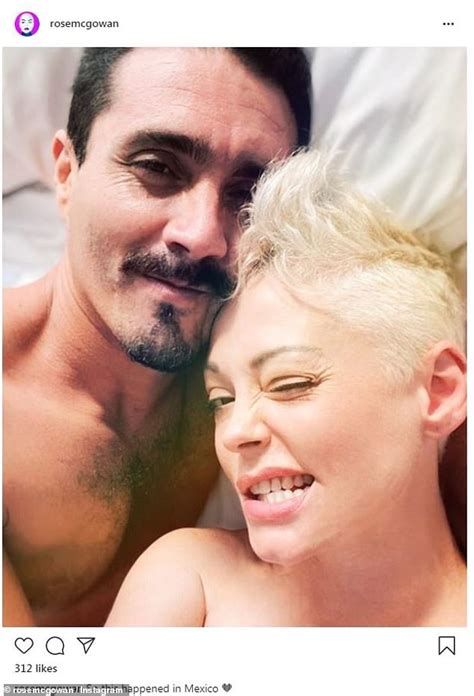 Rose Mcgowan Flashes A Grin As She Lounges In Bed With Handsome Mystery Man During Trip To