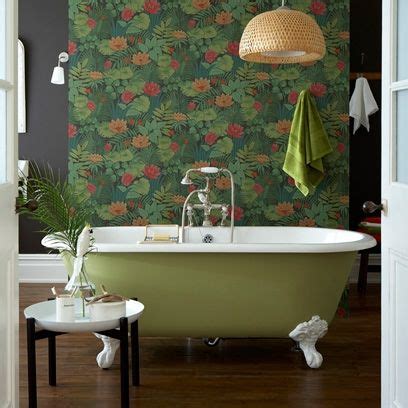 Green rolltop bath with green floral print wallpaper Bathroom Wallpaper