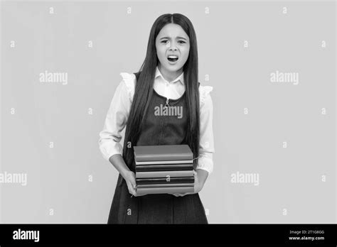 Amazed Teen Girl Schoolgirl With Copy Book Posing On Isolated