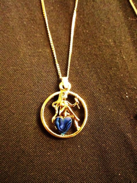 Yellow Gold Plate Nude Lady Sitting On A Blue Heart S Gem