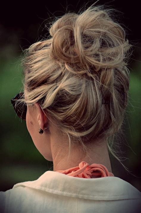 To give your hair a fluffy look, spread your hair a little with your hands. How to Create the Perfect Messy Bun