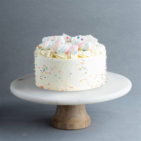 7 Layers Of Light Vanilla Cake Layered Like A Rainbow With Classic