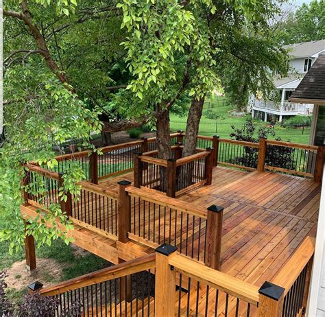 Wood railing designs for decks can use a continuous 2×6 to cap the posts. 3 Cedar Deck Designs that are DEFINITELY worthy of a ...