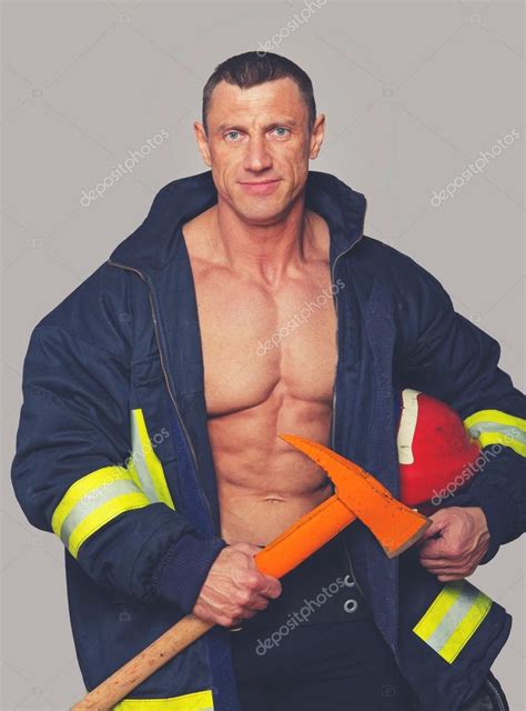Portrait Of Fireman Posing On Grey Background Stock Photo By Fxquadro