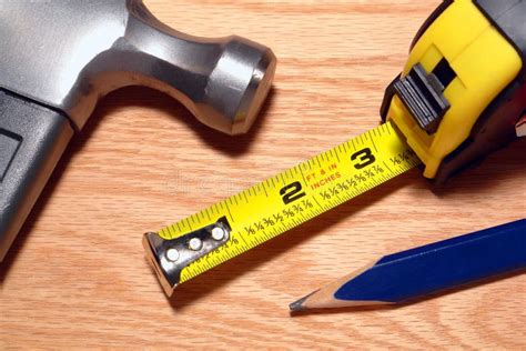 Carpenter Tools Hammer And Tape Measure On Wood Stock Photography