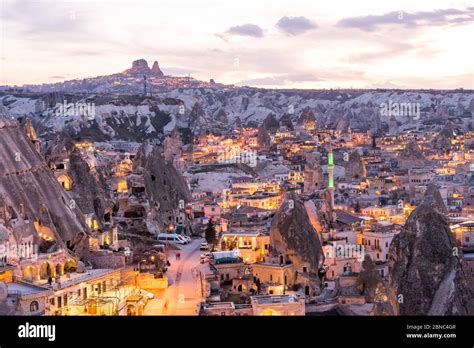 Night View Of Goreme Town With Cave Hotel Built In Rock Formation In