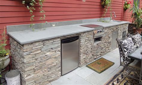 Building an outdoor kitchen with flagstone countertop, storage space for fire woods, a small refrigerator or a grill, is a diy project that can change this rustic outdoor kitchen will add value to your property. Outdoor kitchen islands kits | Hawk Haven