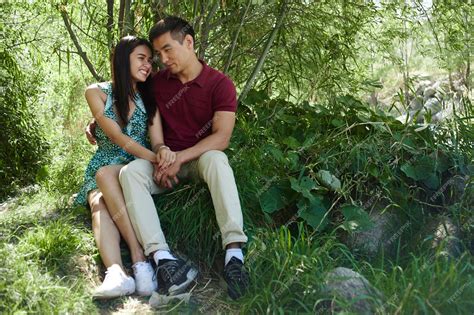 Premium Photo Asian Couple In Love Kazakh Man And Thai Woman Caress Hug And Kiss In A Summer