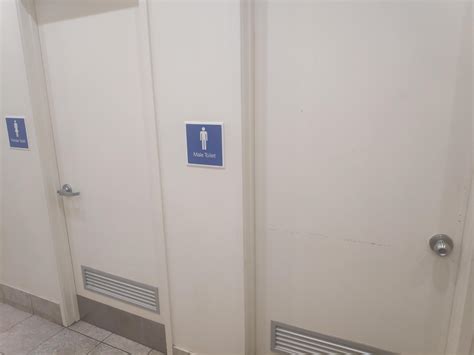 The Male And Female Toilets In This Shopping Centre Have Different Door