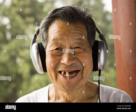 Toothless Man With Headphones Outdoors Smiling Stock Photo Alamy