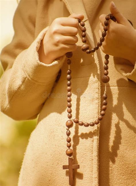 Young Girl Praying With Wooden Rosary Selective Focus Stock Image