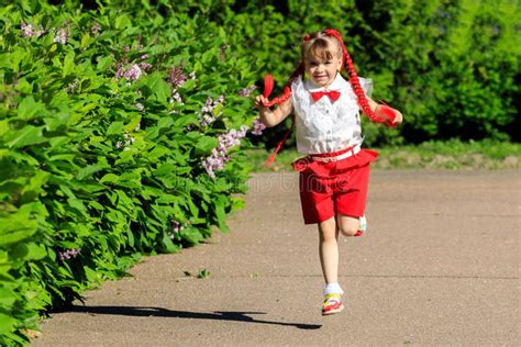 Little Girl Running Around The Park In The Summer Stock Photo Image