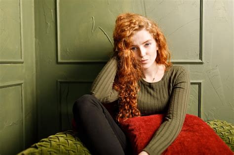 Premium Photo Curly Redhead Girl Relaxing On Comfortable Soft Sofa