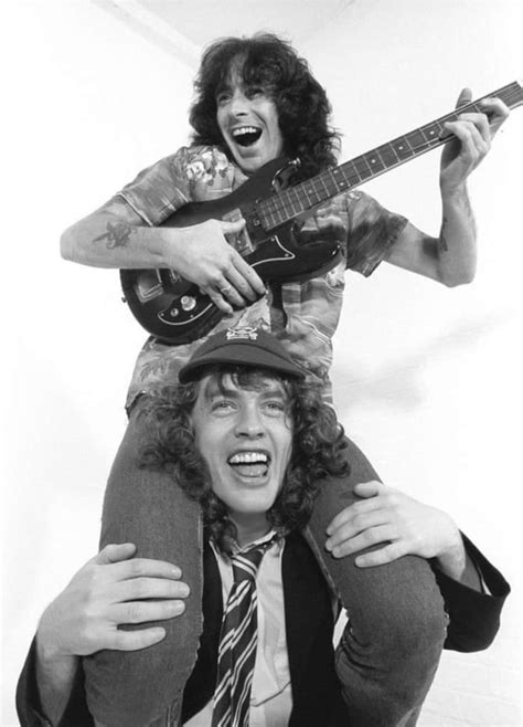 Roles Reversed Bon Scott Of Acdc On Angus Youngs Shoulders 70s 9gag