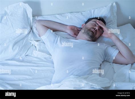 Thoughtful Man Trying To Sleep In His Bed At Night Stock Photo Alamy