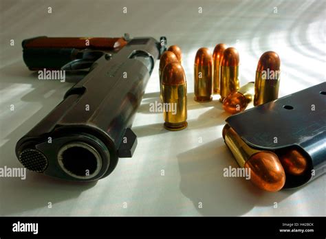 A Colt 45 Acp Auto Automatic Pistol Model 1911 And Bullets Stock Photo
