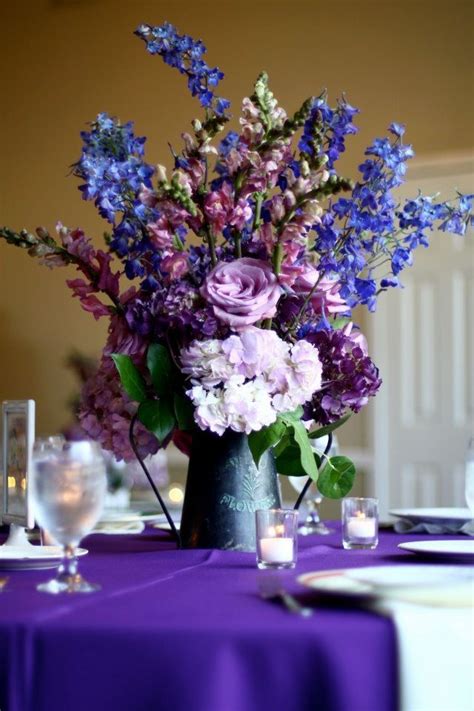 Purple Hydrangea Roses Snapdragon And Lilacs In Rustic Tin Vases