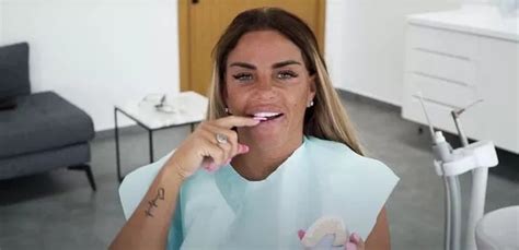 Katie Price Without Veneers Katie Price Spits Out Old Teeth As She
