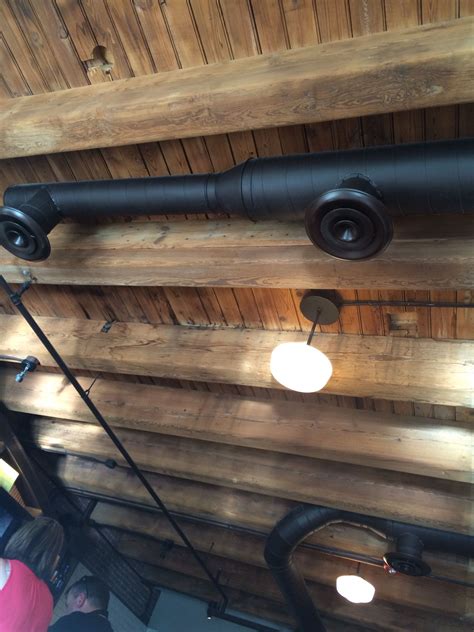 How to light up wooden beams lid design. Exposed beam and duct ceiling | Basement ceiling, Basement ...