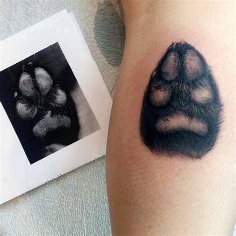 When searching for tattoo inspiration, there are a number of large tattoo styles that can be scaled down and look great as a small tattoo. Lifelike very detailed tattoo of small dog paw ...