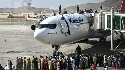 chaos ensues at kabul airport as americans abandon afghanistan the new york times