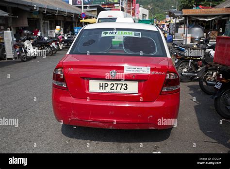 Traditional Red And White Taxi Parked In Penang Malaysia Stock Photo