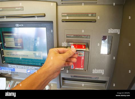 Inserting Debit Card In Bank Of America Atm Usa Stock Photo Alamy