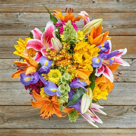 Lily Iris And Sunflower Assorted Bouquet The Bouqs Co