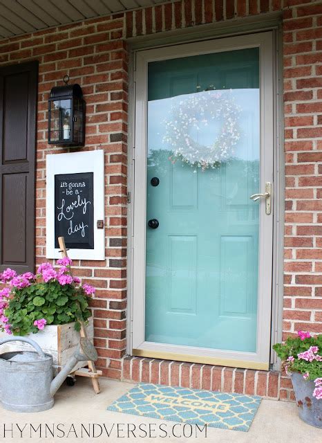 Chic cottage home features taupe siding framing a turquoise front door flanked by sidelights. DIY Outdoor Projects: 15 Colorful Porch Ideas (Part 1 ...