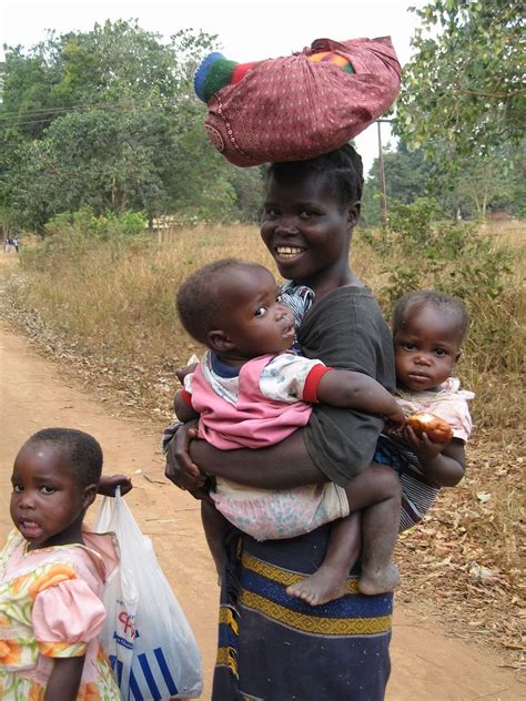 Woman Carrying Blanket And Babies African Children Mother And Child