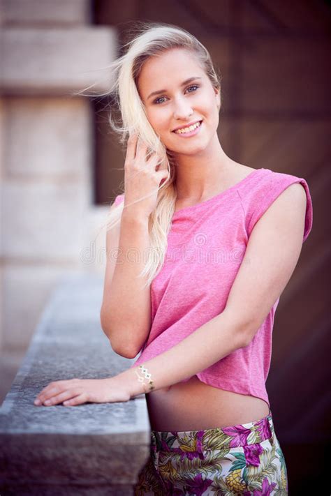 Beautiful Young Blonde Woman On A Walk Around The City Stock Image