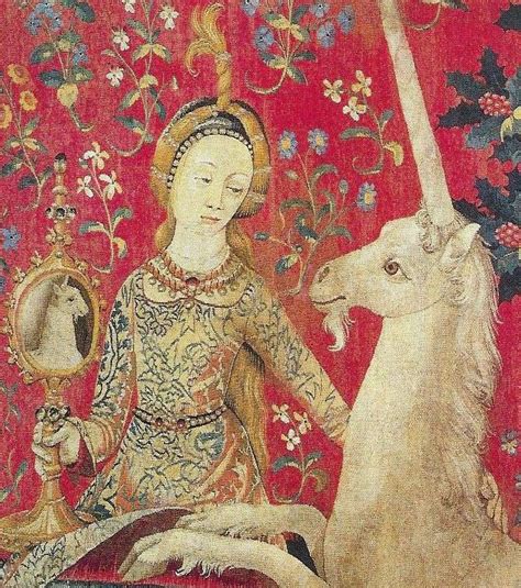 lady holds a mirror up to a unicorn tapestry medieval tapestry renaissance art unicorn