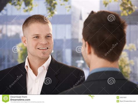 Businessmen Chatting Outside Of Office Stock Image - Image of businessman, happy: 20531837