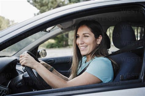 Smiling Beautiful Woman Driving Car Stock Photo